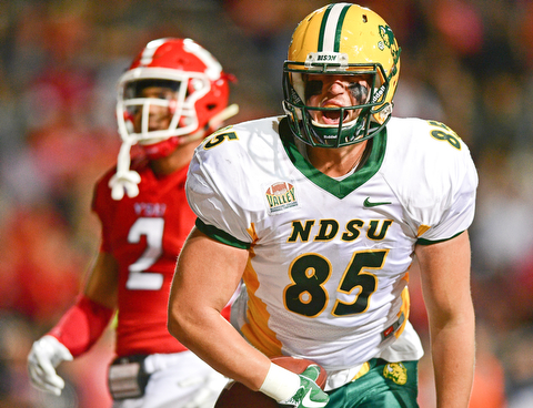 YOUNGSTOWN, OHIO - OCTOBER 14, 2017: North Dakota State's Nate Jenson celebrates after scoring a touchdown beating Youngstown State's Jalyn Powell during the second half of their game Saturday night at Stambaugh Stadium. North Dakota State won 27-24. DAVID DERMER | THE VINDICATOR