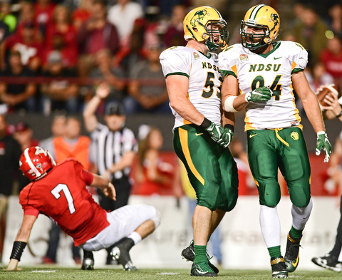 YOUNGSTOWN, OHIO - OCTOBER 14, 2017: North Dakota State's Stanley Jones, right, celebrates with Cole Karcz after a Jones sack of Youngstown State's Nathan Mays during the second half of their game Saturday night at Stambaugh Stadium. North Dakota State won 27-24. DAVID DERMER | THE VINDICATOR