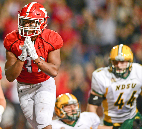 YOUNGSTOWN, OHIO - OCTOBER 14, 2017: Youngstown State's Tevin McCaster celebrates after scoring a touchdown during the second half of their game Saturday night at Stambaugh Stadium. North Dakota State won 27-24. DAVID DERMER | THE VINDICATOR