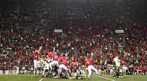 YOUNGSTOWN, OHIO - OCTOBER 14, 2017: Defenders from Youngstown State attempt to leap to block the game winning field goal attempt from North Dakota State's Cam Pedersen in overtime of tonights game at Stambaugh Stadium. North Dakota State won 27-24. DAVID DERMER | THE VINDICATOR