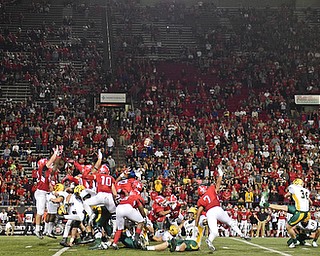 YOUNGSTOWN, OHIO - OCTOBER 14, 2017: Defenders from Youngstown State attempt to leap to block the game winning field goal attempt from North Dakota State's Cam Pedersen in overtime of tonights game at Stambaugh Stadium. North Dakota State won 27-24. DAVID DERMER | THE VINDICATOR