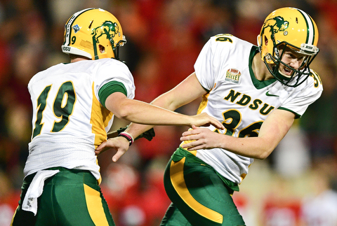 YOUNGSTOWN, OHIO - OCTOBER 14, 2017: North Dakota State's Cam Pedersen, right, celebrates with Jackson Koonce after making the game winning field goal in overtime of their game Saturday night at Stambaugh Stadium. North Dakota State won 27-24. DAVID DERMER | THE VINDICATOR
