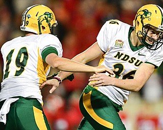 YOUNGSTOWN, OHIO - OCTOBER 14, 2017: North Dakota State's Cam Pedersen, right, celebrates with Jackson Koonce after making the game winning field goal in overtime of their game Saturday night at Stambaugh Stadium. North Dakota State won 27-24. DAVID DERMER | THE VINDICATOR