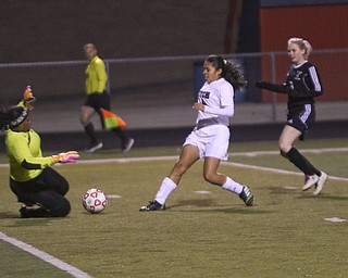     ROBERT K. YOSAY  | THE VINDICATOR..Soccer Sectionals as Austintown Fitch  played  Warren Harding  at Fitch .. The Falcons won 2-0..Fitch #19  Jackie Arroyo  kicks the ball for a goal that was blocked by. India Stovell  as Hardings #6 Kaitlyn Japuncha .-30-