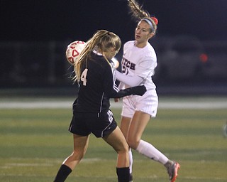     ROBERT K. YOSAY  | THE VINDICATOR..Soccer Sectionals as Austintown Fitch  played  Warren Harding  at Fitch .. The Falcons won 2-0..Harding  #4  Lexi Snowden tries to block a pass by Fitchs #21 Lauren Dolak during first half action.-30-