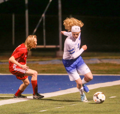 Poland's Reed McCreery (7) keeps the ball from Niles' Tristan DelVecchio (13) during the first half as Niles McKinley High School takes on Poland Seminary High School, Tuesday, Oct. 17, 2017, at Poland High School in Poland. ..(Nikos Frazier | The Vindicator)..