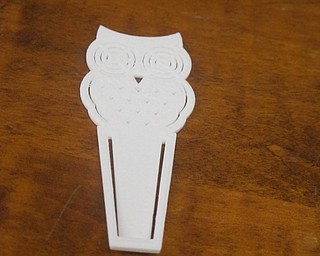 Neighbors | Zack Shively  .Poland library offered an introduction to 3-D printing on Sept. 5 in its large meeting room. Librarian Missy Williams downloaded an owl bookmark and the printer created it.