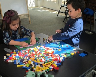 Neighbors | Zack Shively.Childen played with Legos after story time at Poland library's Listen and Lego event. The story librarian Vikki Peck read to the children a book that constructed a dinosaur's face page-by-page.