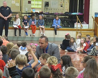 Neighbors | Zack Shively.Boardman Stadium Elementary School hosted a "Patriot Day" assembly to pay respects to the victims of the Sept. 11, 2001 attacks. Principal Michael Zoccali asked what it means to be a hero and went to the students for answers.