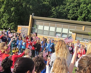 Neighbors | Zack Shively  .Students waved flags during their Patriot Day assembly on Sept. 11 at Stadium Elementary.