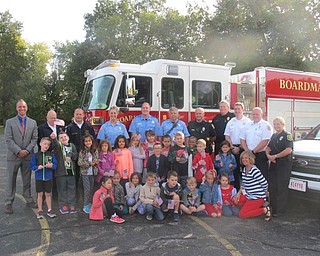 Neighbors | Zack Shively  .Missy Struharik's first-grade class met with Prinicpal Michael Zoccali and members of the emergency services, such as Captain Donald Lamping and Fire Chief Mark Pitzer, during Patriot Day on Sept. 11.