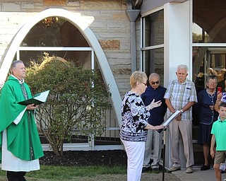 Neighbors | Abby Slanker.Claudia Bair presented a history of Zion Lutheran Church’s bell, as Pastor Duane Jesse looked on, at a ceremony to re-dedicate and ring the bell on Sept. 24.