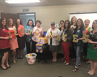 Neighbors | Submitted .The Junior League of Youngstown recently donated diapers for "Diaper Need Awareness Week" to Making Kids Count. Pictured are, from left, (front) Paige Rassega, Michele Merkel, Jessica Foster, Elizabeth Kijowski, Mercia Stevens, Heather Elder, Carisa Sechrist, Carrie Zapka, Kelly Frammartino; (back) Kristina Ross-Pavlicko, Beth Drennen and Kathryn Scheel.