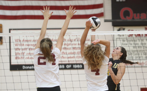 Crestview's MacKencie Daub (15) spikes the ball over South RangeÕs Danielle Vuletich (24) and South RangeÕs Anna Primavera (4) during the first set as Crestview High School takes on South Range High School during the 2017 DIII District Volleyball Tournament, Thursday, Oct. 19, 2017, at Salem High School in Salem. Crestwood won the series, 3-0...(Nikos Frazier | The Vindicator)..