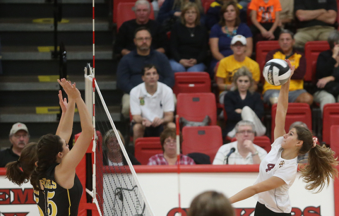 South RangeÕs Anna Primavera (4) spikes the ball as Crestview's MacKencie Daub (15) goes up for the block during the second set as Crestview High School takes on South Range High School during the 2017 DIII District Volleyball Tournament, Thursday, Oct. 19, 2017, at Salem High School in Salem. Crestwood won the series, 3-0...(Nikos Frazier | The Vindicator)..