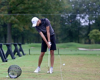 Jimmy Graham, a junior at Warren JFK, practices on the driving range, Monday, Oct. 9, 2017, at Avalon Golf and Country Club in Howland. ..(Nikos Frazier | The Vindicator)..