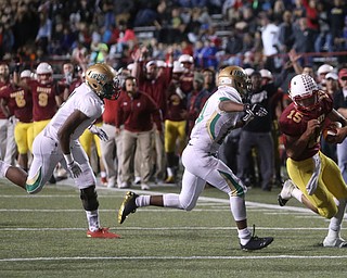 Cardinal Mooney quarterback Antonio Page (15) runs into the endzone for a touchdown during the second quarter as Ursuline High School takes on Cardinal Mooney High School, Friday, Oct. 20, 2017, at Stambaugh Stadium at Youngstown State University in Youngstown...(Nikos Frazier | The Vindicator)..