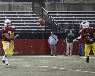 Cardinal Mooney quarterback Antonio Page (15) passes to Cardinal Mooney runningback Chris Gruber (2) during the second quarter as Ursuline High School takes on Cardinal Mooney High School, Friday, Oct. 20, 2017, at Stambaugh Stadium at Youngstown State University in Youngstown...(Nikos Frazier | The Vindicator)..