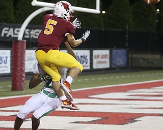 Cardinal Mooney wide receiver Nico Marchionda (5) goes up for a pass in the final seconds of the second quarter, but is blocked by Ursuline wide receiver Duane Leggett (29)  as Ursuline High School takes on Cardinal Mooney High School, Friday, Oct. 20, 2017, at Stambaugh Stadium at Youngstown State University in Youngstown...(Nikos Frazier | The Vindicator)..
