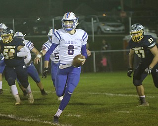 ROBERT K.YOSAY | THE VINDICATOR..Western Reserve at McDonald week 9..Western Reserve #8 Dominicc Velasquez breaks out of the backfield and heads for 6 yards as McDonald 53 Lucky November and #57 Calvin Wolford look on.