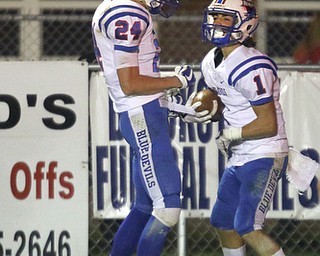 ROBERT K.YOSAY | THE VINDICATOR..Western Reserve at McDonald week 9..#24 Kade Hilles congratulates #1 Ryan Demsky after his early in the 3rd quarter TD catch to put Western Reserve on the Board first