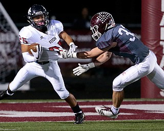 BOARDMAN, OHIO - OCTOBER 20, 2017:  Boardman's Connor Miller (33) tackles Austintown's Randolph Smith Jr. (25) for a loss during the 1st qtr. at Spartan Stadium. MICHAEL G TAYLOR | THE VINDICATOR