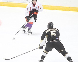 Youngstown Phantoms left wing Eric Esposito (7) goes up against Muskegon Lumberjacks forward Wyatt Bongiovanni (5) during the first period as the Muskegon Lumberjacks take on the Youngstown Phantoms, Saturday, Oct. 21, 2017, at the Covelli Centre in Youngstown...(Nikos Frazier | The Vindicator)..