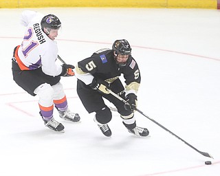 Youngstown Phantoms center Mike Regush (21) tries to steal the puck from Muskegon Lumberjacks forward Wyatt Bongiovanni (5) during the first period as the Muskegon Lumberjacks take on the Youngstown Phantoms, Saturday, Oct. 21, 2017, at the Covelli Centre in Youngstown...(Nikos Frazier | The Vindicator)..