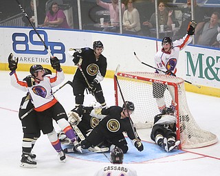 Muskegon Lumberjacks forward Monte Graham (11) and Muskegon Lumberjacks goalie Adam Brizgala (1)  collide to allow Youngstown Phantoms center Curtis Hall (20)'s goal as he and Youngstown Phantoms forward Chase Gresock (19)  celebrate during the second period as the Muskegon Lumberjacks take on the Youngstown Phantoms, Saturday, Oct. 21, 2017, at the Covelli Centre in Youngstown...(Nikos Frazier | The Vindicator)..