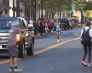 Ezekiel Kosger(9067) runs down the final stretch before the finish line during the 42nd annual Youngstown Peace Race, Sunday, Oct. 22, 2017, in Youngstown. Kosger placed first with a run time of 30:07...(Nikos Frazier | The Vindicator)
