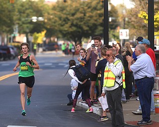 Ryan Roush(8880) approaches the finish line to place second with a time of 30:16 during the 42nd annual Youngstown Peace Race, Sunday, Oct. 22, 2017, in Youngstown...(Nikos Frazier | The Vindicator)