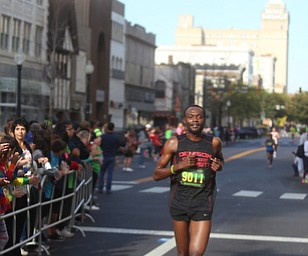 Markorobondo Saluko (9011) of Cleveland places fourth with a time of 30:52 during the 42nd annual Youngstown Peace Race, Sunday, Oct. 22, 2017, in Youngstown...(Nikos Frazier | The Vindicator)