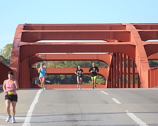 Runners cross the Mahoning Ave. bridge during the 42nd annual Youngstown Peace Race, Sunday, Oct. 22, 2017, in Youngstown...(Nikos Frazier | The Vindicator)