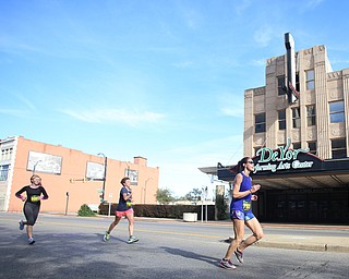 Runners run past the DeYor Performing Arts Center on W. Federal St. during the 42nd annual Youngstown Peace Race, Sunday, Oct. 22, 2017, in Youngstown...(Nikos Frazier | The Vindicator)