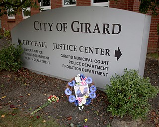 A wreath lays at the foot of the City of Girard sign, Sunday, Oct. 22, 2017, at outside the City Justice Center in Girard. Officer Leo was killed while responding to a potential suicide around 10:00 p.m., Saturday, Oct. 21, 2017, on the 400 block of Indiana Ave in Girard. Officer Leo was transported to St. ElizabethÕs Youngstown for surgery where he later died. ..(Nikos Frazier | The Vindicator)