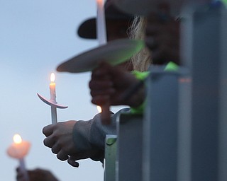Local community members hold candles during a vigil for Girard Police Officer Justin Leo, Sunday, Oct. 22, 2017, at Arrowhead Stadium in Girard. Officer Leo was killed while responding to a potential suicide around 10:00 p.m., Saturday, Oct. 21, 2017, on the 400 block of Indiana Ave in Girard. Officer Leo was transported to St. ElizabethÕs Youngstown for surgery where he later died. ..(Nikos Frazier | The Vindicator)