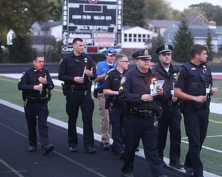 Police officers from surrounding agencies attend a vigil for Girard Police Officer Justin Leo, Sunday, Oct. 22, 2017, at Arrowhead Stadium in Girard. Officer Leo was killed while responding to a potential suicide around 10:00 p.m., Saturday, Oct. 21, 2017, on the 400 block of Indiana Ave in Girard. Officer Leo was transported to St. ElizabethÕs Youngstown for surgery where he later died. ..(Nikos Frazier | The Vindicator)