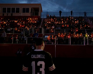 Bobby Caldwell holds a candle during a vigil for Girard Police Officer Justin Leo, Sunday, Oct. 22, 2017, at Arrowhead Stadium in Girard. Officer Leo was killed while responding to a potential suicide around 10:00 p.m., Saturday, Oct. 21, 2017, on the 400 block of Indiana Ave in Girard. Officer Leo was transported to St. ElizabethÕs Youngstown for surgery where he later died. ..(Nikos Frazier | The Vindicator)