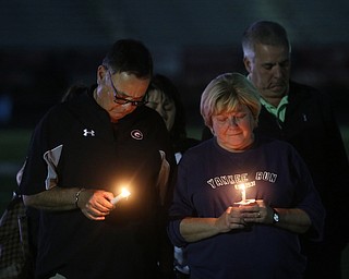David and Pat Leo stand with candles during a vigil for their son, Girard Police Officer Justin Leo, Sunday, Oct. 22, 2017, at Arrowhead Stadium in Girard. Officer Leo was killed while responding to a potential suicide around 10:00 p.m., Saturday, Oct. 21, 2017, on the 400 block of Indiana Ave in Girard. Officer Leo was transported to St. ElizabethÕs Youngstown for surgery where he later died. ..(Nikos Frazier | The Vindicator)
