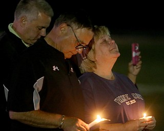 David and Pat Leo stand with candles during a vigil for their son, Girard Police Officer Justin Leo, Sunday, Oct. 22, 2017, at Arrowhead Stadium in Girard. Officer Leo was killed while responding to a potential suicide around 10:00 p.m., Saturday, Oct. 21, 2017, on the 400 block of Indiana Ave in Girard. Officer Leo was transported to St. ElizabethÕs Youngstown for surgery where he later died. ..(Nikos Frazier | The Vindicator)