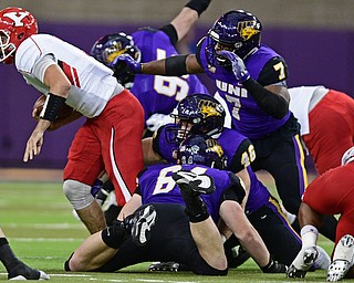 CEDAN FALLS, IOWA - OCTOBER 21, 2017: Youngstown State's Nathan Mays is sacked by Northern Iowa's Hezekiah Applegate, Jared Farley and Rickey Neal during the first half of their game Saturday afternoon at the UNI Dome. Northern Iowa won 19-14. DAVID DERMER | THE VINDICATOR