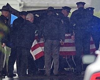 GIRARD, OHIO - OCTOBER 23, 2017: The casket for Officer Justin Leo is moved into Blackstone Funeral Home by members of the Girard Police Department, Ohio High Way State Patrol, as well as others, Monday afternoon. DAVID DERMER | THE VINDICATOR