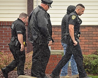 GIRARD, OHIO - OCTOBER 23, 2017: Officers from the Youngstown Police Department walk back to their squad cars after the casket for Officer Justin Leo was moved into Blackstone Funeral Home, Monday afternoon. DAVID DERMER | THE VINDICATOR