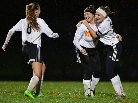 NEW SPRINGFIELD, OHIO - OCTOBER 23, 2017: Springfield's Shantel Springer and Cierra Latronica celebrate with Kaylee Kosek after Springer scored a goal during the second half of their game Monday night at Springfield High School. Springfield won 5-1. DAVID DERMER | THE VINDICATOR