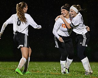 NEW SPRINGFIELD, OHIO - OCTOBER 23, 2017: Springfield's Shantel Springer and Cierra Latronica celebrate with Kaylee Kosek after Springer scored a goal during the second half of their game Monday night at Springfield High School. Springfield won 5-1. DAVID DERMER | THE VINDICATOR