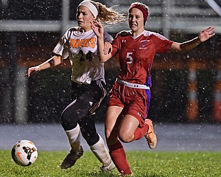 NEW SPRINGFIELD, OHIO - OCTOBER 23, 2017: Springfield's Cierra Latronica dribbles up field while being pressured by Lordstown's Ciara Pyles during the second half of their game Monday night at Springfield High School. Springfield won 5-1. DAVID DERMER | THE VINDICATOR