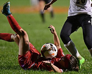 NEW SPRINGFIELD, OHIO - OCTOBER 23, 2017: Lordstown's Liv Faler has the ball roll off her after she stumbled and fell while trying to play the ball while being pressured by Springfield's Lexie Milton during the second half of their game Monday night at Springfield High School. Springfield won 5-1. DAVID DERMER | THE VINDICATOR