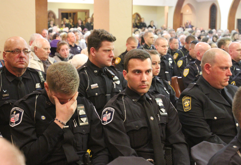 William D. Lewis The Vindicator Somber officers attended vigil for slain GPD officer Justin Leo 10-24-17.