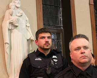 William D. Lewis The Vindicator Officers from many area departments attended 10-24-17 prayer vigil for salin GPD officer Justin Leo at St rose Church Adam rios of Bazetta Pd, left, and Chad McGary of Liberty..