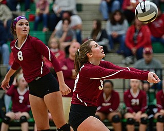 BELOIT, OHIO - OCTOBER 24, 2017: Mooney's Maria Pelini, right, bumps the ball while Mahen Patty watches during their OHSAA Tournament match, Wednesday night at West Branch High School. DAVID DERMER | THE VINDICATOR